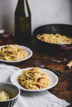 Homamade classic carbonara pasta on white plate