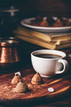 Homemade chocolate truffles coated with black coffee