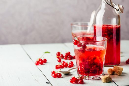 Infused water with fresh red currant and cane sugar