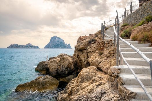 View of Es Vedra and climbing stairs