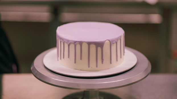 white cake without decor on a stand