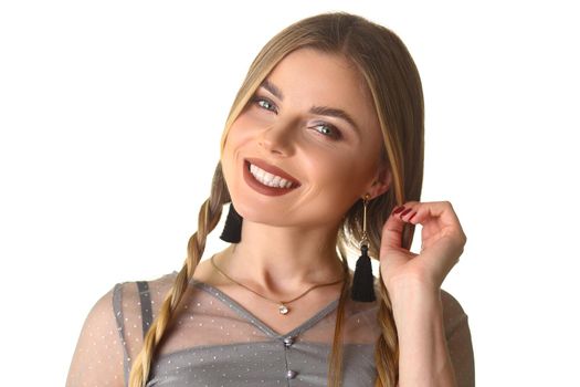 Happy woman with long pigtail and beautiful makeup. Evening stylish makeup concept
