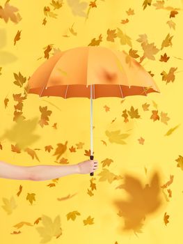 3D rendering of crop anonymous female demonstrating orange umbrella against yellow background with falling dry leaves on autumn day