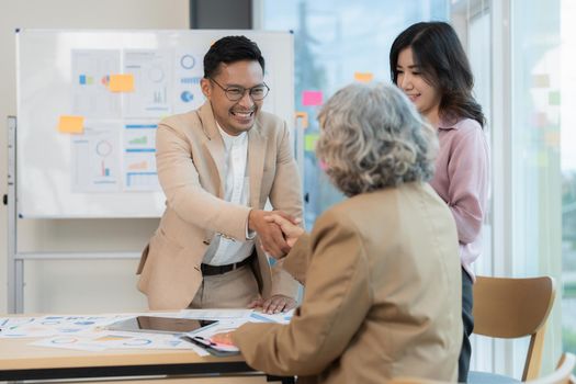 Image businessmans handshake. Successful business people handshaking after good deal.