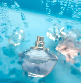 Perfumery, cosmetics and branding concept - Perfume bottle under blue water, fresh sea coastal scent as glamour fragrance and eau de parfum product as holiday gift, luxury beauty spa brand present