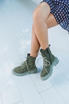 Close-up of comfortable women's boots made of genuine leather. New collection of winter shoes for stylish girls. Fashionable women's stylish leather boots.
