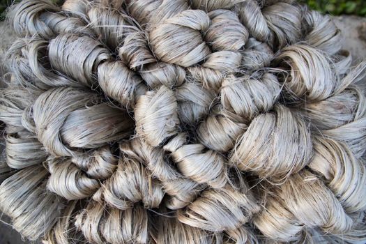 thick brown bundle of raw jute fiber Texture Background