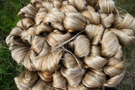 thick brown bundle of raw jute fiber Texture Background