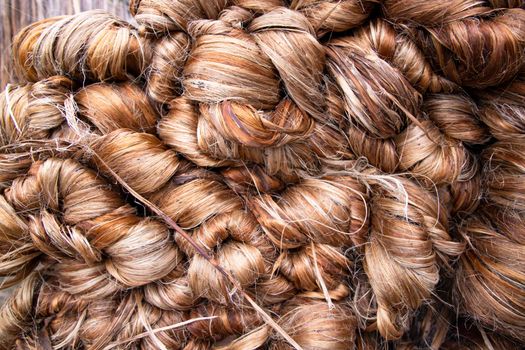 Thick Golden bundle of Wet raw jute fiber Texture Background