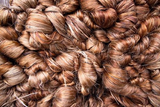 Thick Golden bundle of Wet raw jute fiber Texture Background