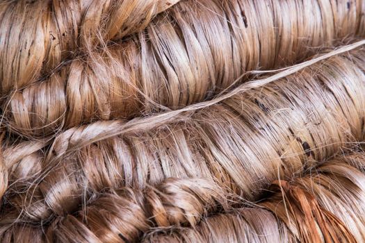 A thick bundle of Golden jute fiber Texture Background