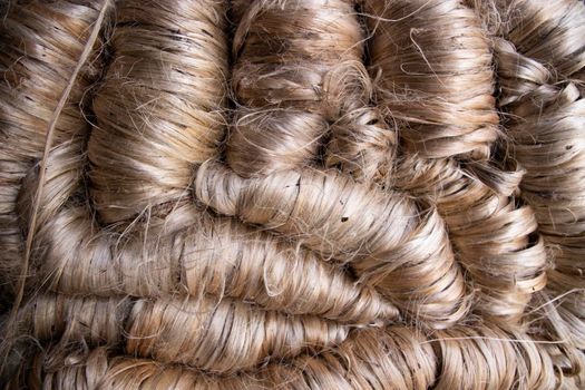 A thick bundle of Golden jute fiber Texture Background