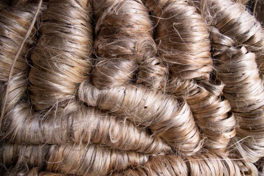A thick bundle of Golden jute fiber Texture Background