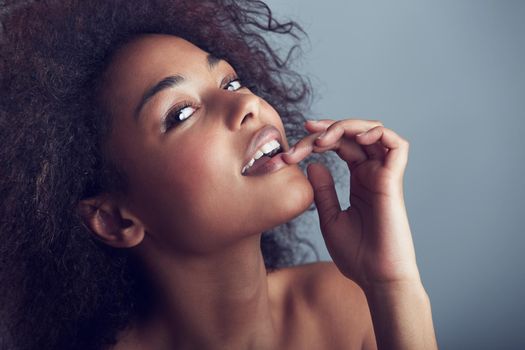 Cheeky confidence amp beauty. Beauty shot of a gorgeous young woman flirting with the camera