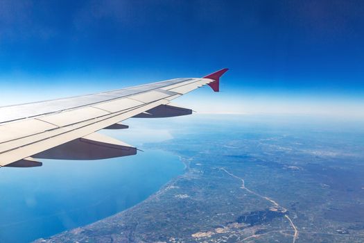 Wing of an airplane. Traveling concept. Aircraft wing on the clouds.