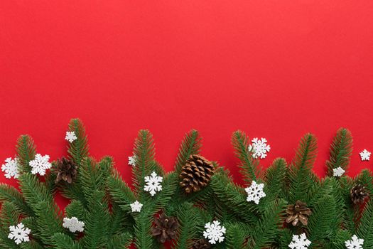 Christmas background with fir branches and Christmas decor. Top view, copy space for text.