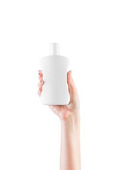 Female hand holding cream bottle of lotion isolated. Girl give cosmetic products on white background.