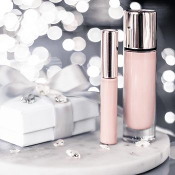 Cosmetic branding, Christmas glitter and girly blog concept - Holiday make-up foundation base, concealer and white gift box, luxury cosmetics present and blank label products for beauty brand design