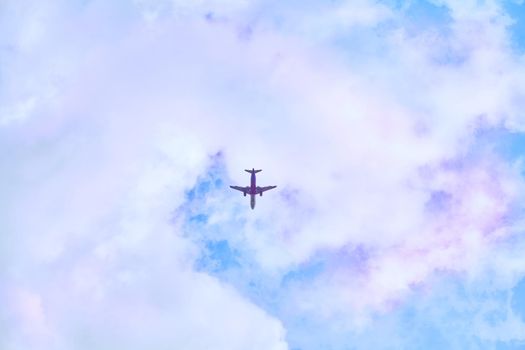 a flat surface on which a straight line joining any two points on it would wholly lie. Red passenger plane in blue sky with pink clouds