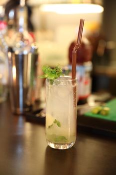 cocktails in glasses on bar counter in pup or restaurant