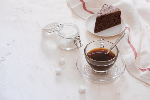 Drip coffee (dripper) and drip ground coffee with glass drip pot, cup and chocolate cake