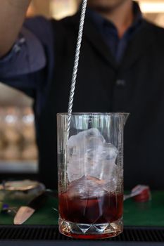 cocktails in glasses on bar counter in pup or restaurant