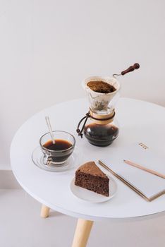 Breakfast with chocolate cake and coffee served on a beautiful living home 