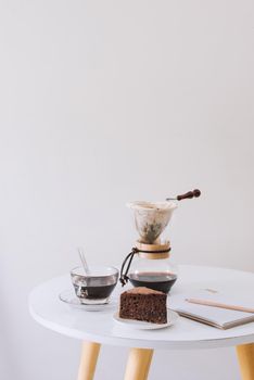 Breakfast with chocolate cake and coffee served on a beautiful living home 