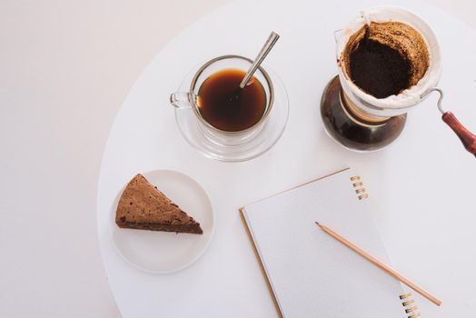 Breakfast with chocolate cake and coffee served on a beautiful living home 