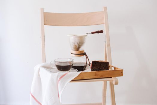 Serving hot coffee in the living room of his home in the morning