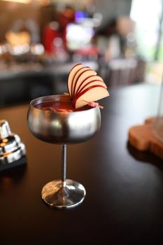 cocktails in glasses on bar counter in pup or restaurant