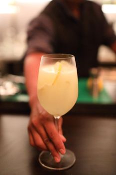 cocktails in glasses on bar counter in pup or restaurant