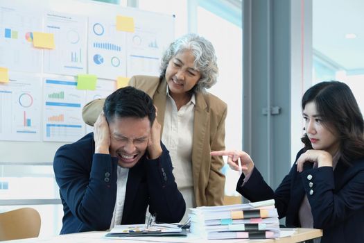 Stressed annoyed office employee having headache migraine at business finance meeting.