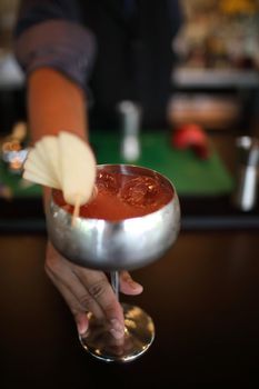 cocktails in glasses on bar counter in pup or restaurant