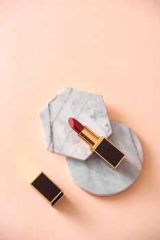 Red matte lipstick style on pastel isolated background