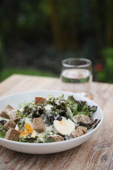 caesar salad appetizer on wooden background