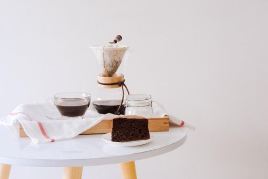 Breakfast with chocolate cake and coffee served on a beautiful living home 