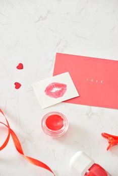 Happy Valentine's Day concept on vintage paper sheet with lipstick