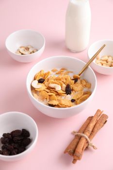 Cereal dessert with corn oat and dry fruits isolated in pink background