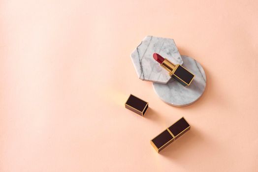 Red matte lipstick style on pastel isolated background