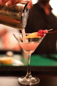 cocktails in glasses on bar counter in pup or restaurant