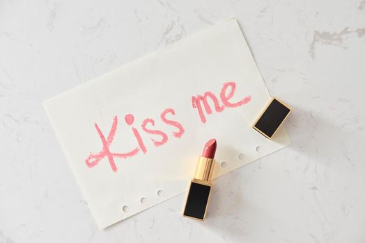 a kiss on a white background lipstick. selective focus.