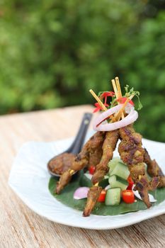 Chicken Satay on dark brown table street food appetizer