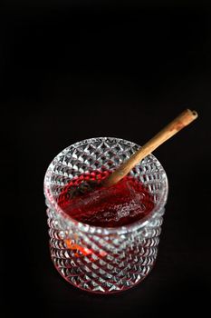 Pink Cocktail glass with ice at a bar counter