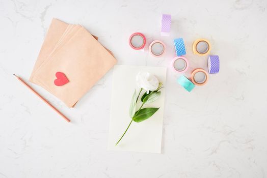 Making decorations or greeting card. Paper strips, flower, scissors. Handmade crafts on holiday: Birthday, Mother's or Father's Day, March 8, Wedding. 