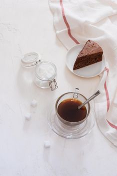 Drip coffee (dripper) and drip ground coffee with glass drip pot, cup and chocolate cake