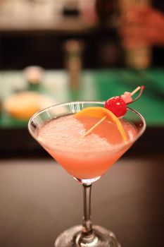 cocktails in glasses on bar counter in pup or restaurant