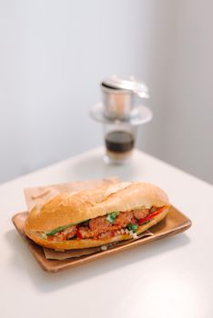 Banh Mi Xiu Mai is a popular pork ball sandwich with tomato sauce in Vietnam