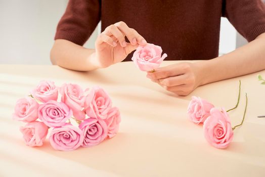 People making paper craft flower art 