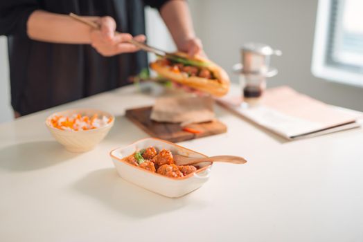 Meatballs served with tomato sauce as sandwich, Vietnamese breakfast